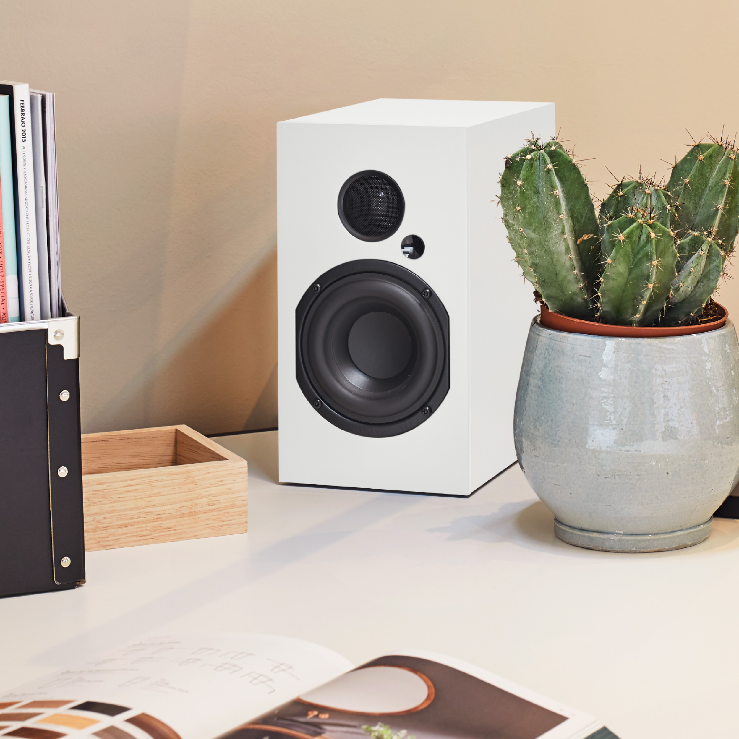 nuBoxx A 125 Pro Ambiente White nuBoxx A 125 Pro bookshelf loudspeaker on desk