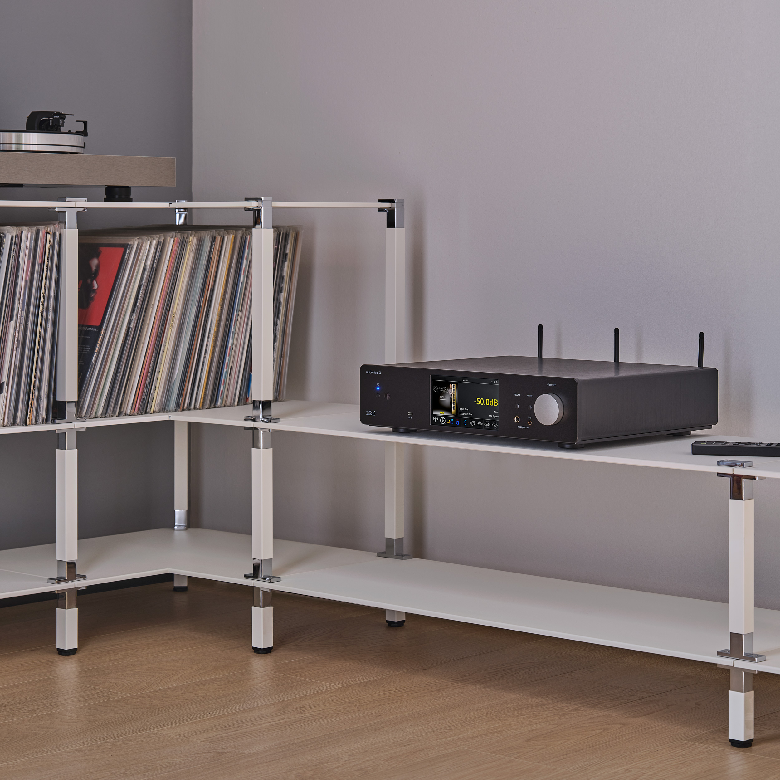 nuControl X Ambiente nuControl X amplifier on a white shelf